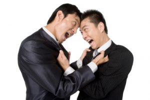 Businessmen fighting